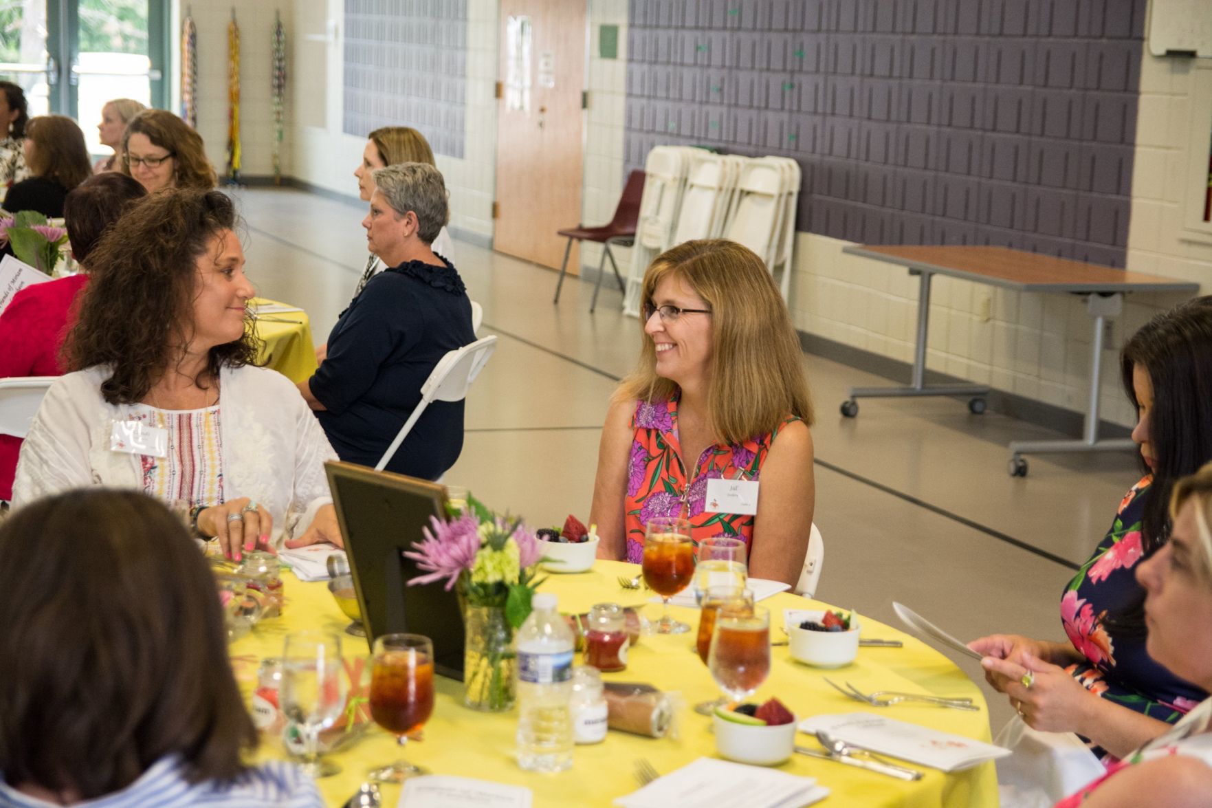 Attendees of the event mingle and chat